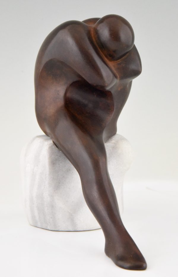 Bronze sculpture of a man on a marble base