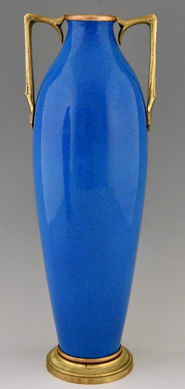 Une paire de vases Art Deco en ceramique blue et bronze