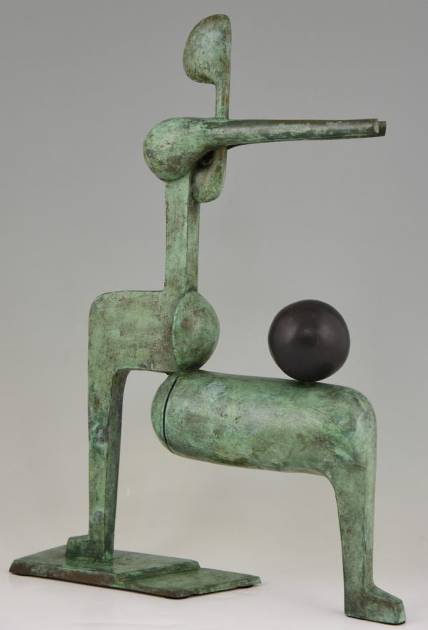 Modern bronze sculpture figure with ball.