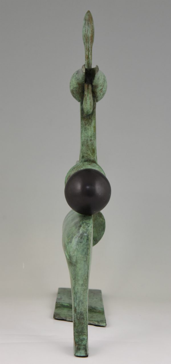 Modern bronze sculpture figure with ball.