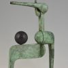 Modern bronze sculpture figure with ball.