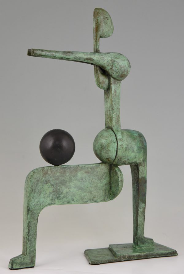 Modern bronze sculpture figure with ball.
