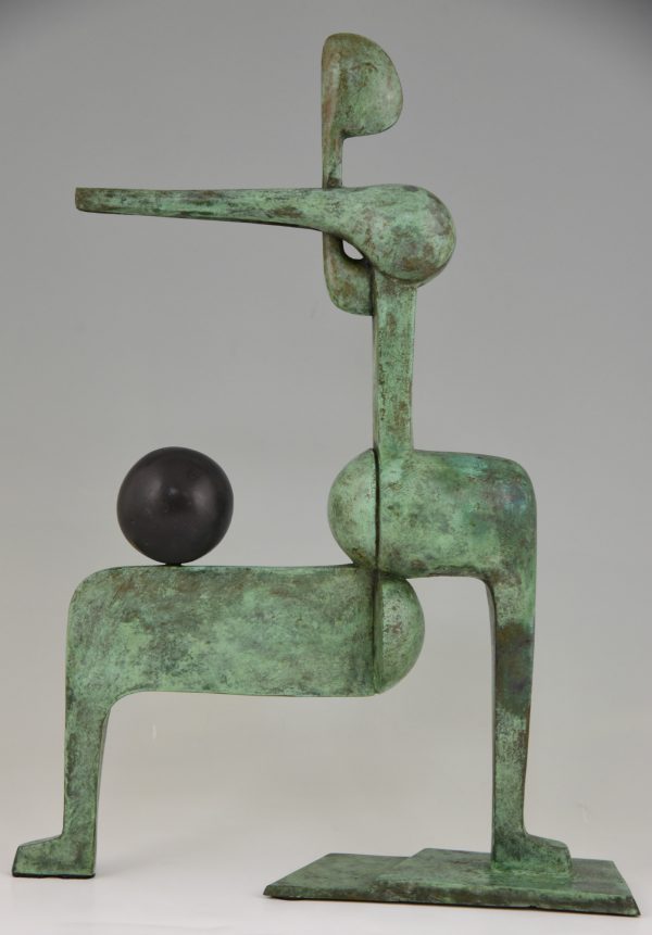 Modern bronze sculpture figure with ball.