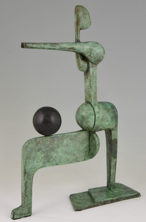 Modern bronze sculpture figure with ball.