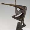 Modern bronze sculpture of a balancing woman