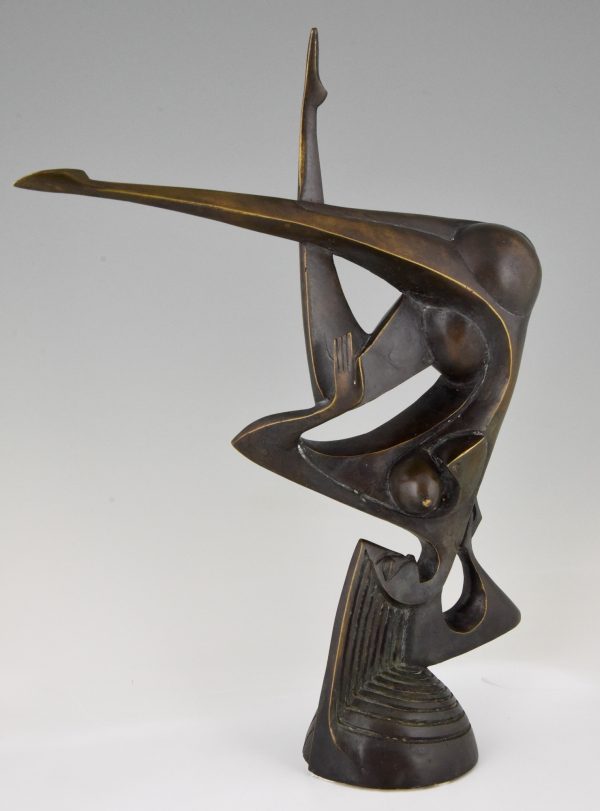 Modern bronze sculpture of a balancing woman