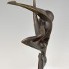 Modern bronze sculpture of a balancing woman