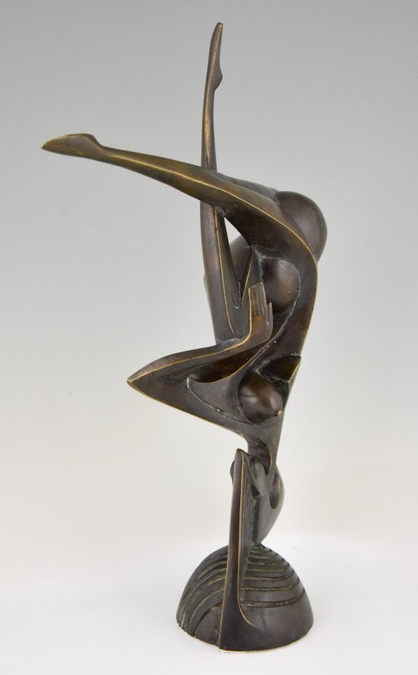 Modern bronze sculpture of a balancing woman