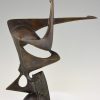 Modern bronze sculpture of a balancing woman