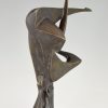 Modern bronze sculpture of a balancing woman