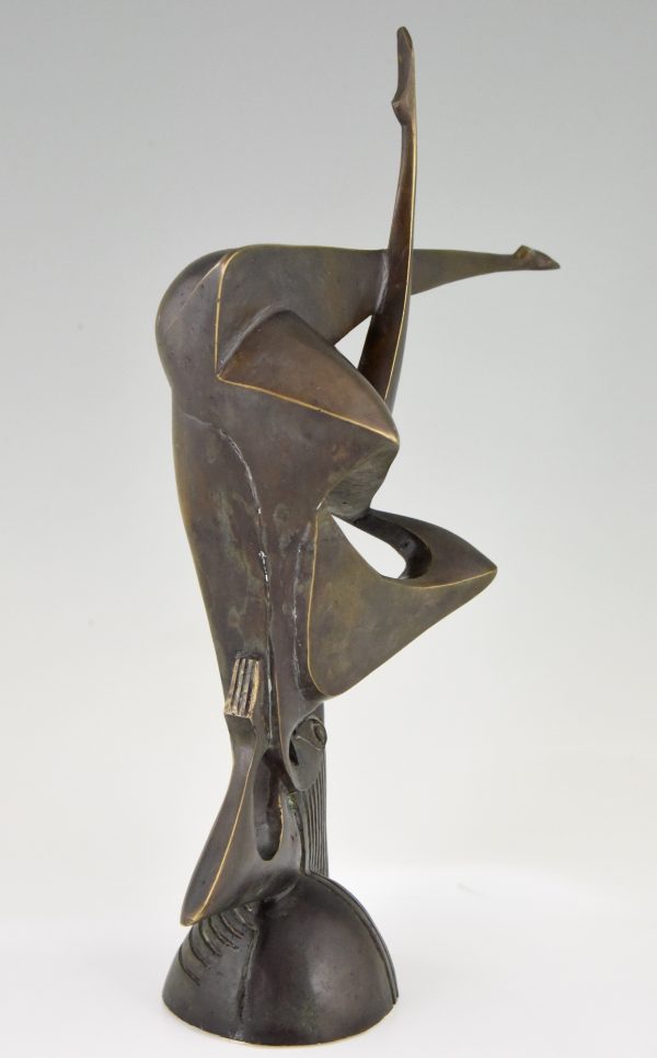 Modern bronze sculpture of a balancing woman