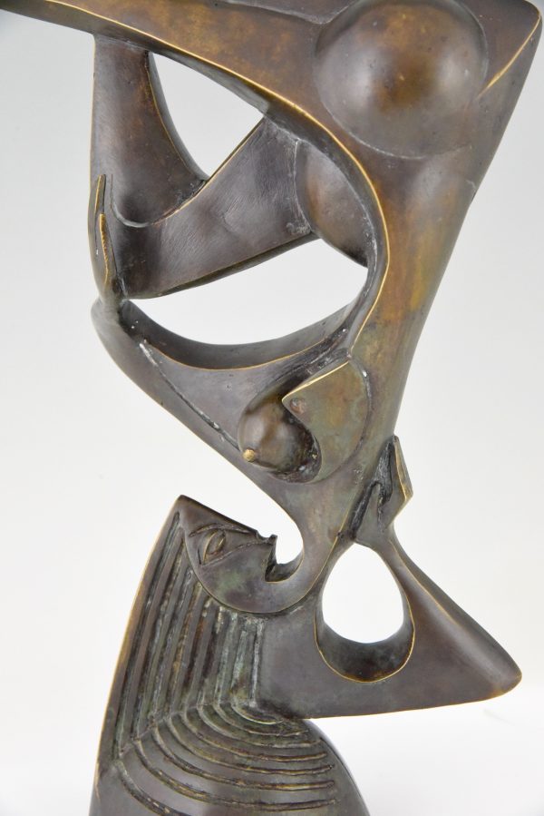 Modern bronze sculpture of a balancing woman