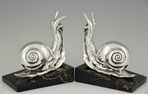 Art deco boekensteunen verzilverd brons slakken