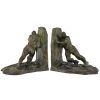 Art Deco bronzen boekensteunen twee duwende mannen