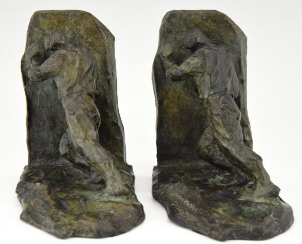 Art Deco bronzen boekensteunen twee duwende mannen