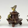 Antique bronze inkwell and vases with birds