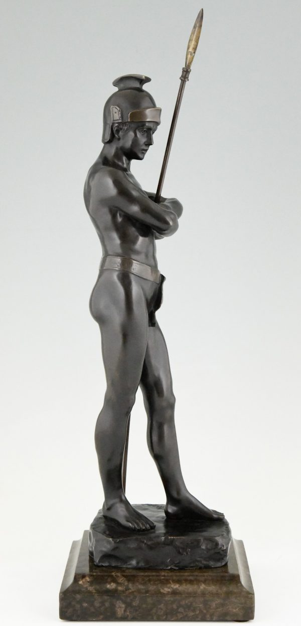 Antique bronze sculpture of a standing Roman warrior