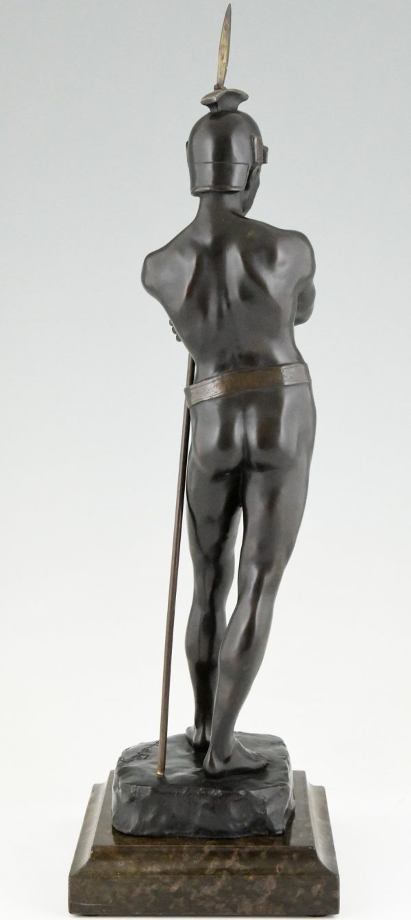 Antique bronze sculpture of a standing Roman warrior