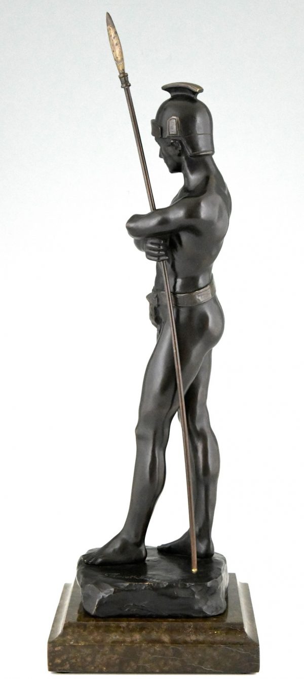 Antique bronze sculpture of a standing Roman warrior