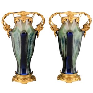 Impressive pair of Art Nouveau ceramic and bronze vases