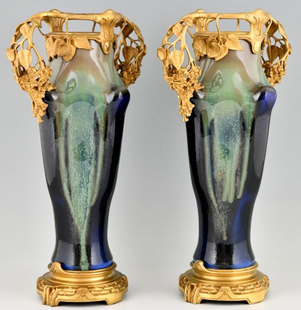 Impressive pair of Art Nouveau ceramic and bronze vases