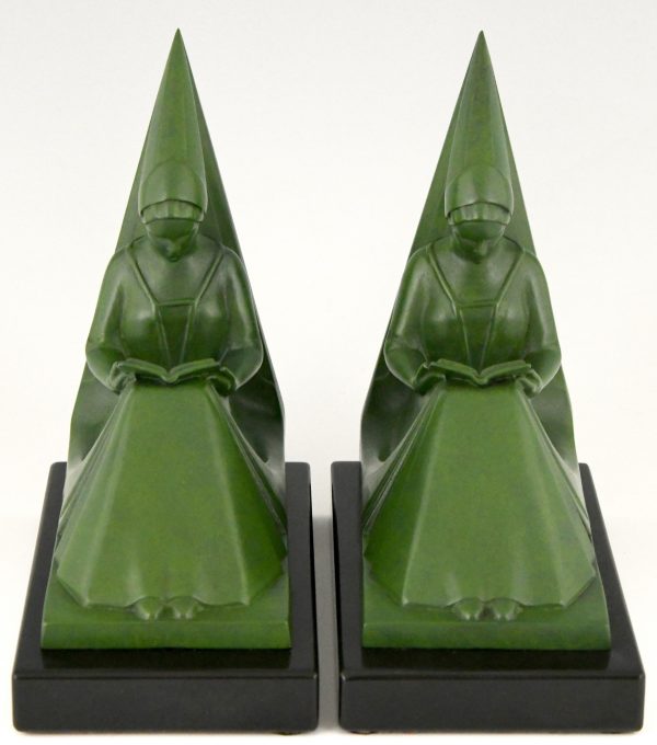 Art Deco bookends reading Medieval ladies