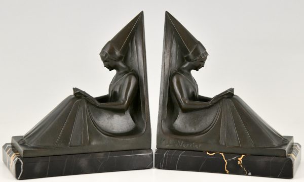 Art Deco bookends reading Medieval ladies