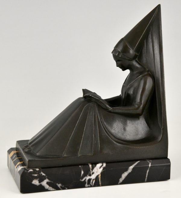 Art Deco bookends reading Medieval ladies