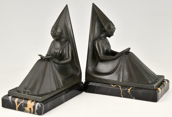 Art Deco bookends reading Medieval ladies