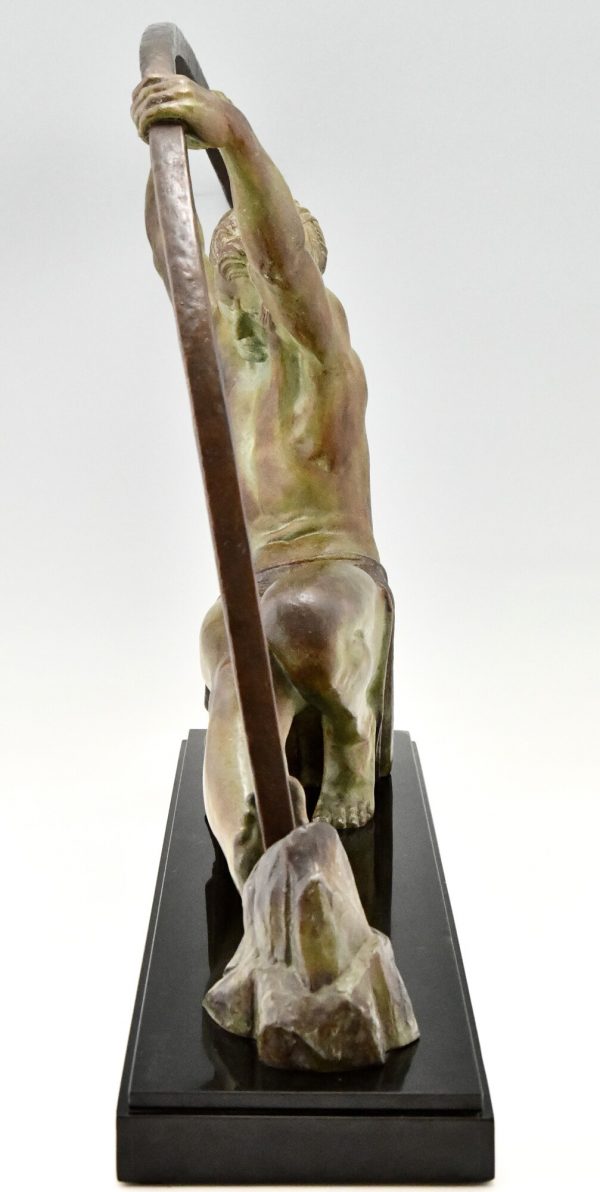 Art Deco sculpture “l’age du bronze” homme avec barre