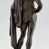 Orpheus Antique bronze sculpture of a male nude with lyre and cape.
