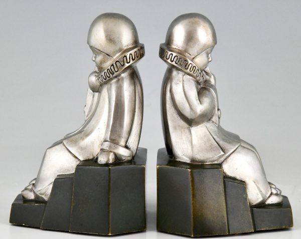 Art Deco serre livres en bronze Pierrots