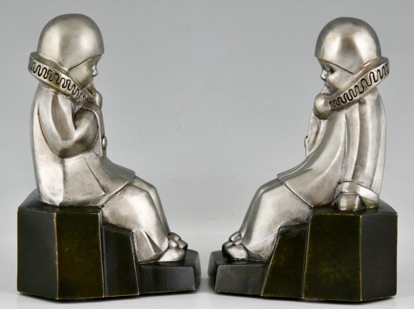 Art Deco bronzen boekensteunen met pierrots