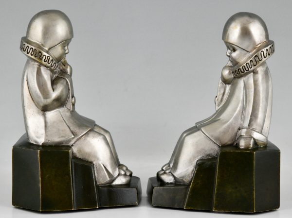 Art Deco serre livres en bronze Pierrots