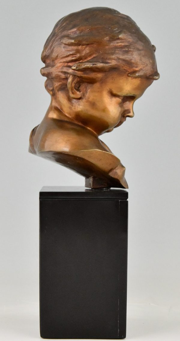 Antique bronze sculpture bust of a boy, cupid.