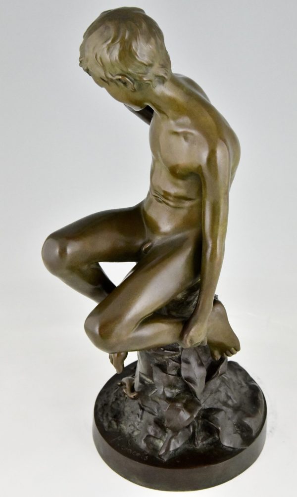 Antique bronze sculpture boy with lizard