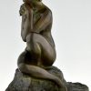 Art Deco bronze sculpture seated nude with flowers.