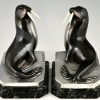 Art Deco bronzen boekensteunen met walrussen.