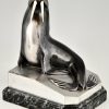 Art Deco bronzen boekensteunen met walrussen.