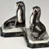 Art Deco bronzen boekensteunen met walrussen.