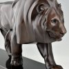 Art Deco style sculpture of a walking lion.