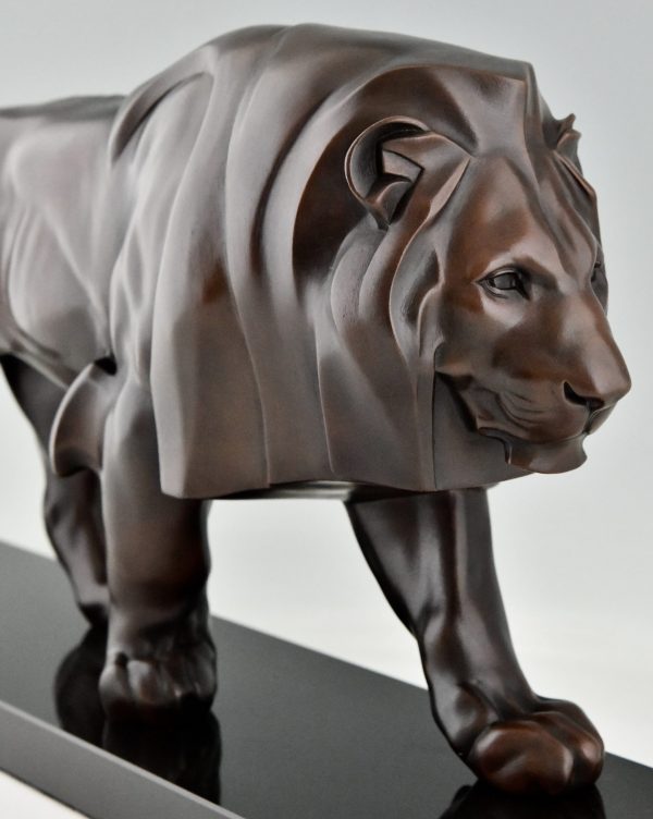 Art Deco style sculpture of a walking lion.