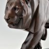 Art Deco style sculpture of a walking lion.