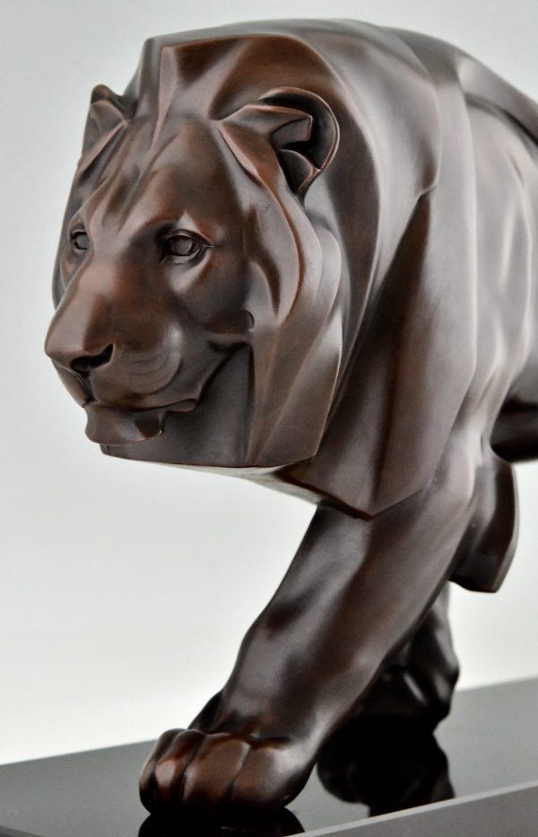 Art Deco style sculpture of a walking lion.