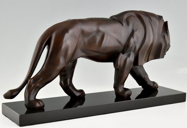 Art Deco style sculpture of a walking lion.