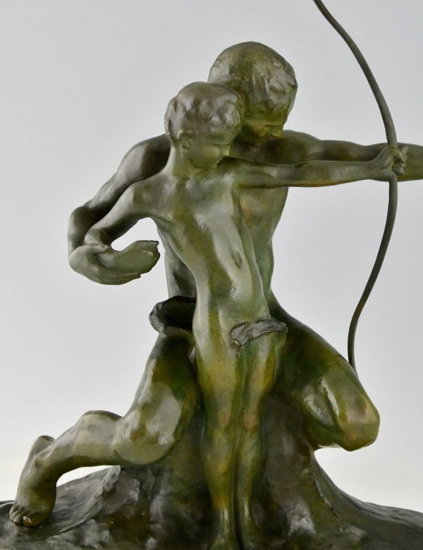 Art Deco bronze sculpture archer learning a boy to use a bow