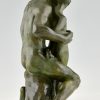 Art Deco bronze sculpture archer learning a boy to use a bow