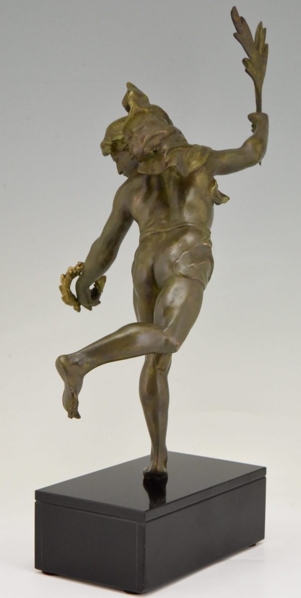 Antique sculpture of a man with laurel branch.