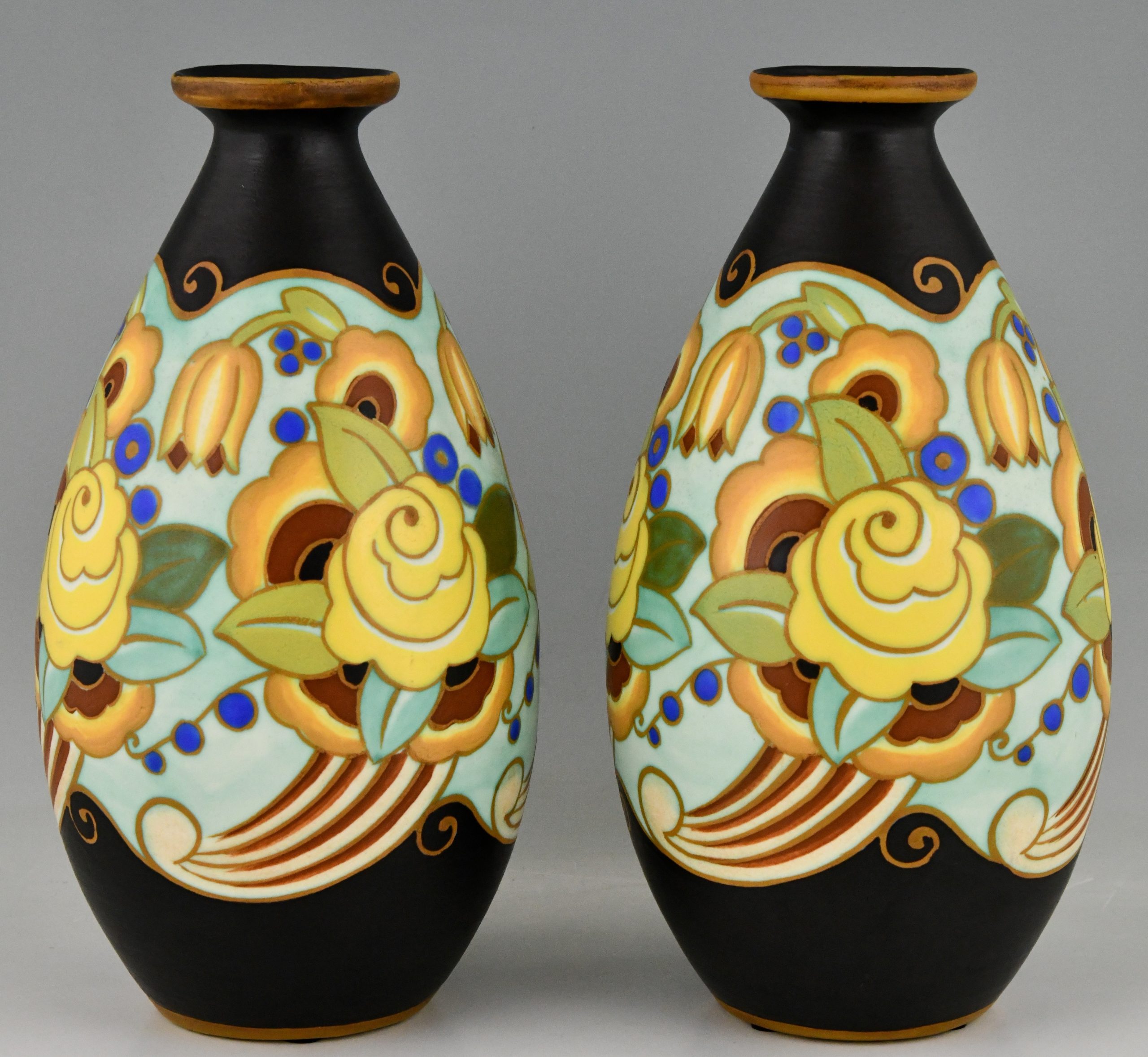 Art Deco ceramic vases with flowers.