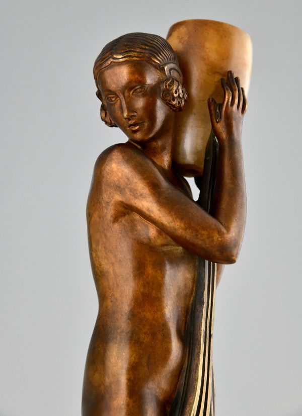 Art Deco bronze lamp sculpture draped nude holding a vase